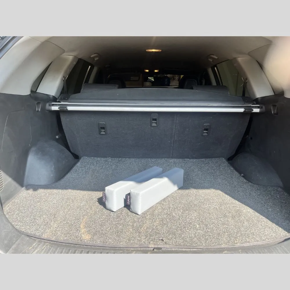 BootGrip Mini car boot organiser securing cargo on a vehicle carpet